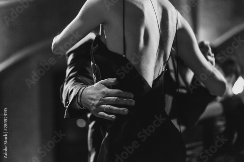 A man and a woman dancing tango. Black and white image