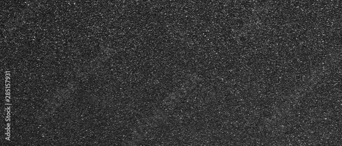 Panorama black sandpaper texture background. Panoramic dark black sandpaper texture surface