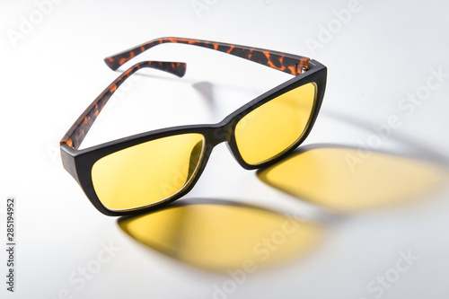 Stylish glasses on light background