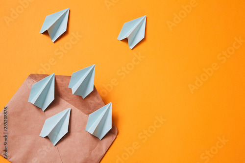Concept for sending e-mails and e-commerce business. Email marketing. Paper planes flying out of the envelope