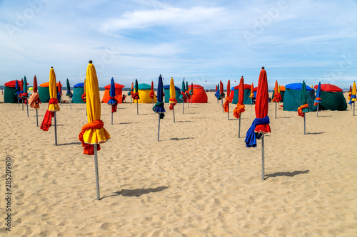 Colourful parasols on Deauville Beach, landmark of the place, Normandy, Northern France.