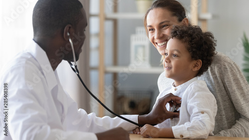 African male pediatrician hold stethoscope exam child boy patient