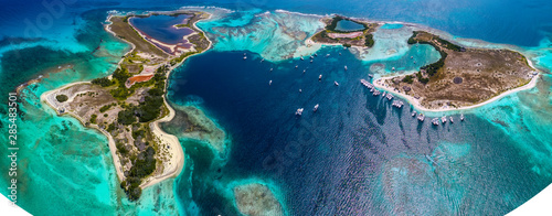 Caribbean: Vacation in the blue sea and deserted islands. Aerial view of a blue sea with crystal water. Great landscape. Beach scene. Aerial View Island Landscape Los Roques