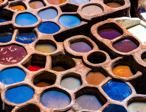 Fez is also famous for its old leather Tanneries. Old tanks of the Fez's tanneries with color paint for leather, Morocco, Africa. Artistic picture. Beauty world