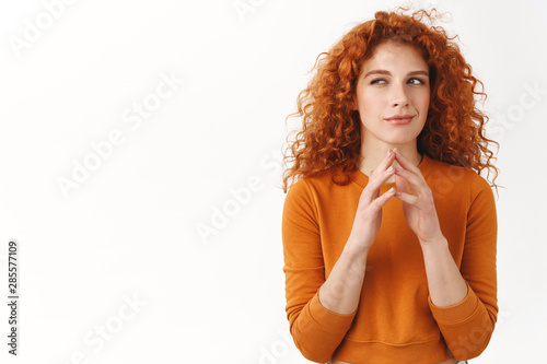 My evil plan is perfect. Hideous gorgeous redhead female scheming something, steeple fingers, squinting cunning and smirk, made-up good idea, thinking, pondering choices, stand white background