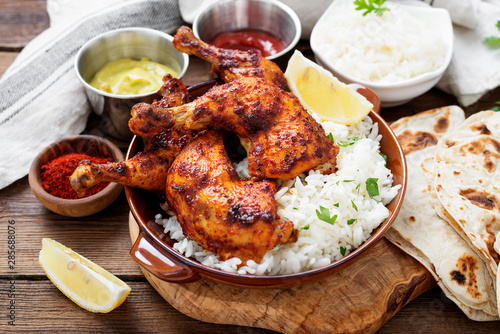 Tandoori chicken with jasmine rice and pita bread, indian cuisine.