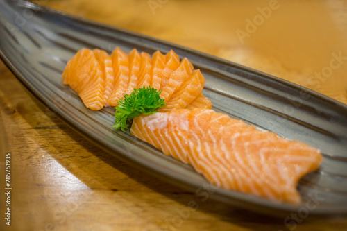 Fresh salmon sashimi sliced , focus selective
