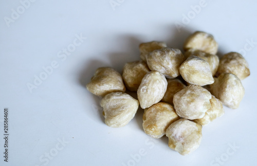 Candlenut or aleurites moluccana on white background.