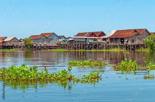 The colorful stilt houses in the floating village of Kompong Khleang by the Tonle Sap lake, Siem Reap, Cambodia.