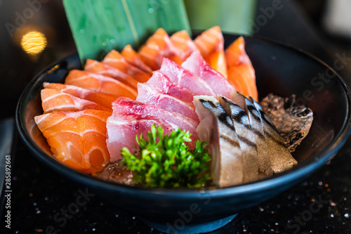 Salmon,tuna,saba sashimi, raw fish in traditional Japanese style in Japanese restaurant.