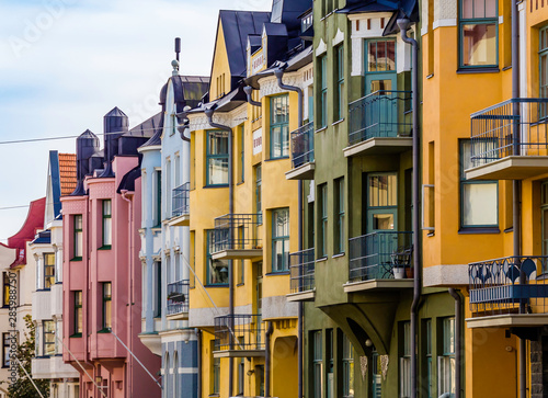 Helsinki, Finland, August 10, 2019: Colorful houses along the most beautiful street Huvilakatu in Helsinki, Finland