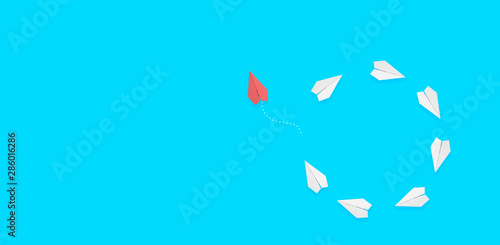 group of consecutive paper planes. The red plane leaves the group and sets its course. Innovative concept