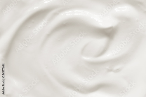 Cream, yogurt texture. White dairy food background.