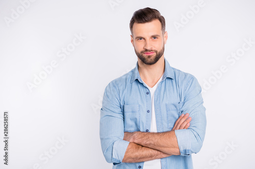 Portrait of his he nice-looking attractive lovely masculine bearded guy folded arms isolated over light white pastel background