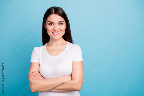 Photo of smart kind friendly business woman showing her cleverness while isolated with blue background