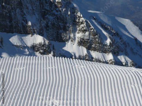 Trace of ratrak (snowcat) - slope is prepared for skiing