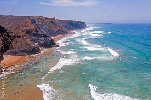 Aerial from Vale Figueiras beach on a beautiful summer day in Portugal