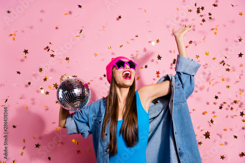 Portrait of cheerful youngster waving her palm screaming shouting wearing blue body suit isolated over pink background