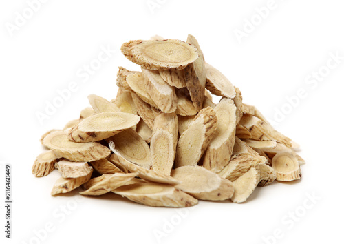 Chinese Herbal medicine - Astragalus slices, Huang Qi (Astragalus propinquus) on white background