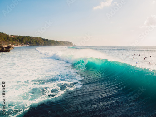 Blue wave in ocean, drone shot. Aerial view of barrel wave