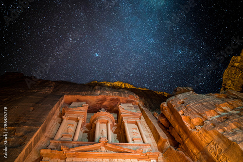 Petra treasury by night lighten by candles and galaxy