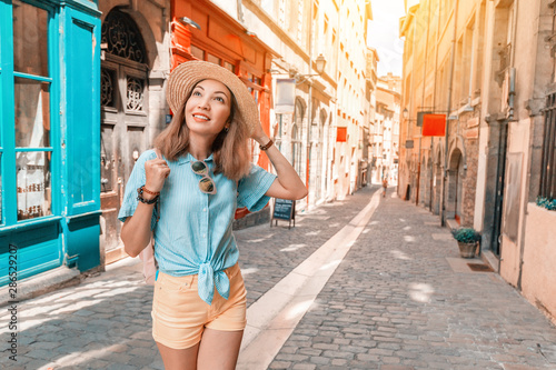 Young carefree girl walking in narrow streets of Lyon old town, Travel and lifestyle in France