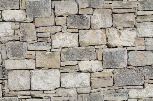 Dry stone wall as seamless background