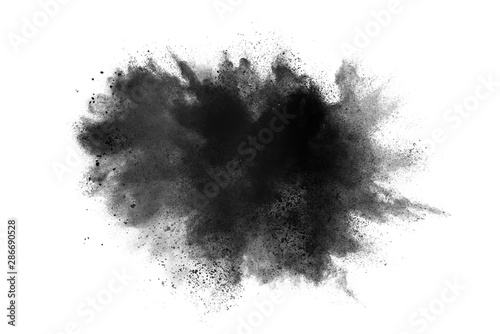 abstract powder splatted background. Black powder explosion on white background. Colored cloud. Colorful dust explode. Paint Holi.