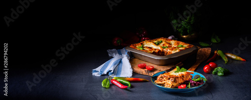 spicy lasagne with tomato sauce and basil