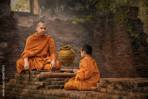 Monks convey and teach the Dharma to novices, at ancient temples in Phra Nakhon Si Ayutthaya, Thailand.