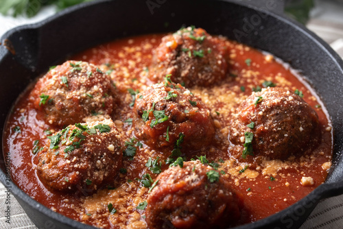 meatballs with tomato sauce in cast iron skillet