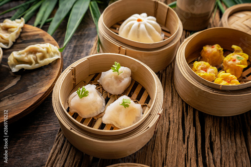 Dim sum, Dim Sum on the wooden table, top view and space for text input , Dim Sum (Chinese food) in steamed bamboo