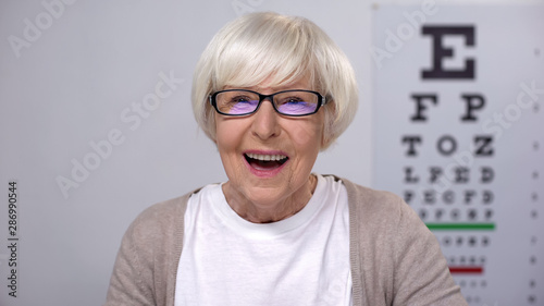 Extremely happy retired woman enjoying perfect eye sight in new glasses, health