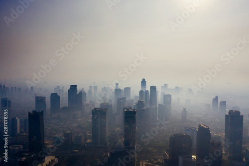 Air pollution scenic with silhouette of skyscrapers