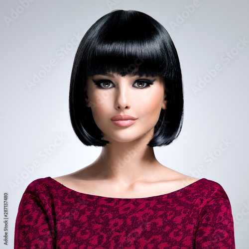 Beautiful brunette woman with bob hairstyle.