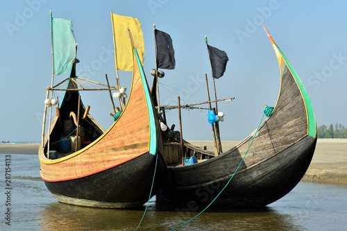 The traditional fishing boat (Sampan Boats) moored on the longest beach, Cox's Bazar in Bangladesh.