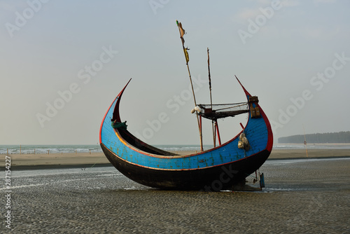 The traditional fishing boat (Sampan Boats) moored on the longest beach, Cox's Bazar in Bangladesh.