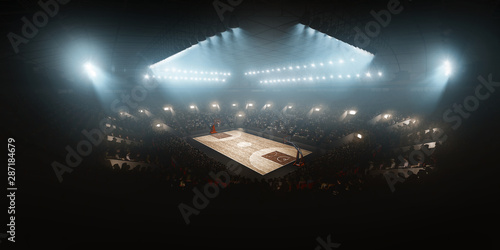 Professional floodlit basketball arena with spectators and fans cheering. High angle view