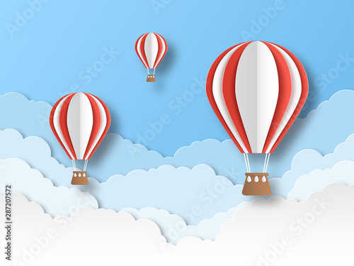Air balloon paper cut. Colourful flying balloons in blue sky with white clouds. Airship travel 3d origami cartoon vector background