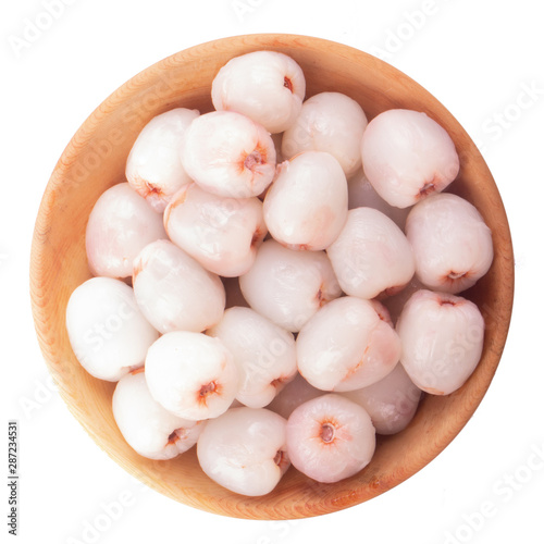 heap of peeled lychees isolated on white background in wooden plate