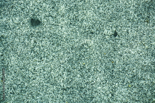  Natural granite under water. Waves create a unique pattern.
