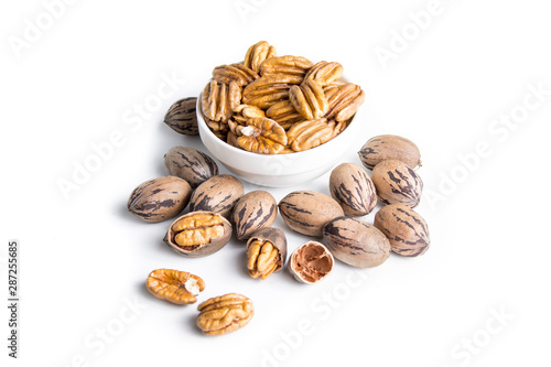 Organic pecan nuts on a white background
