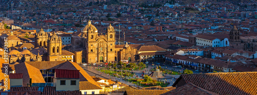Cusco at sunset panorama with Plaza de Armas main square, cathedral and Compania de Jesus Jesuit church, Peru.