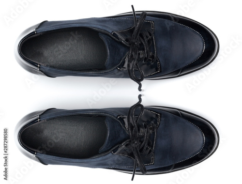 Classic male leather shoes isolated on a white, top view.