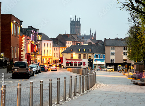 Cars parked in a row at Kilkennys town and castles view in the background, Kilkenny, Ireland.