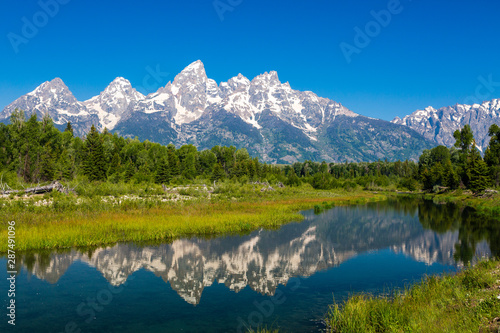 The Tetons reflected in the Snake River at Schwabacher Landing in Grand Teton National Park, Wyoming