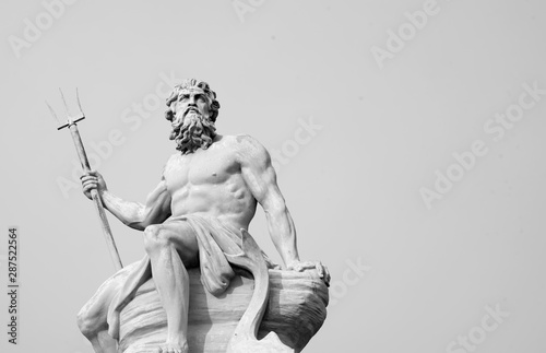 The mighty god of the sea and oceans Neptune (Poseidon) The ancient statue. Black and white image.