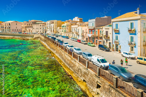View of an embankment in Ortygia (Ortigia), Syracuse. Picturesque cityscape of an ancient historical town on Sicily, Italy