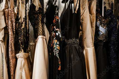 Luxurious evening night out sparkling dresses hanging on the rack. High fashion concept, haute couture, designer 