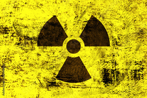 Radioactivity symbol on yellow grunge background